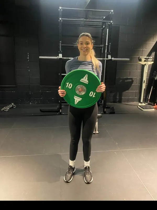 Abi holding the weight she lost