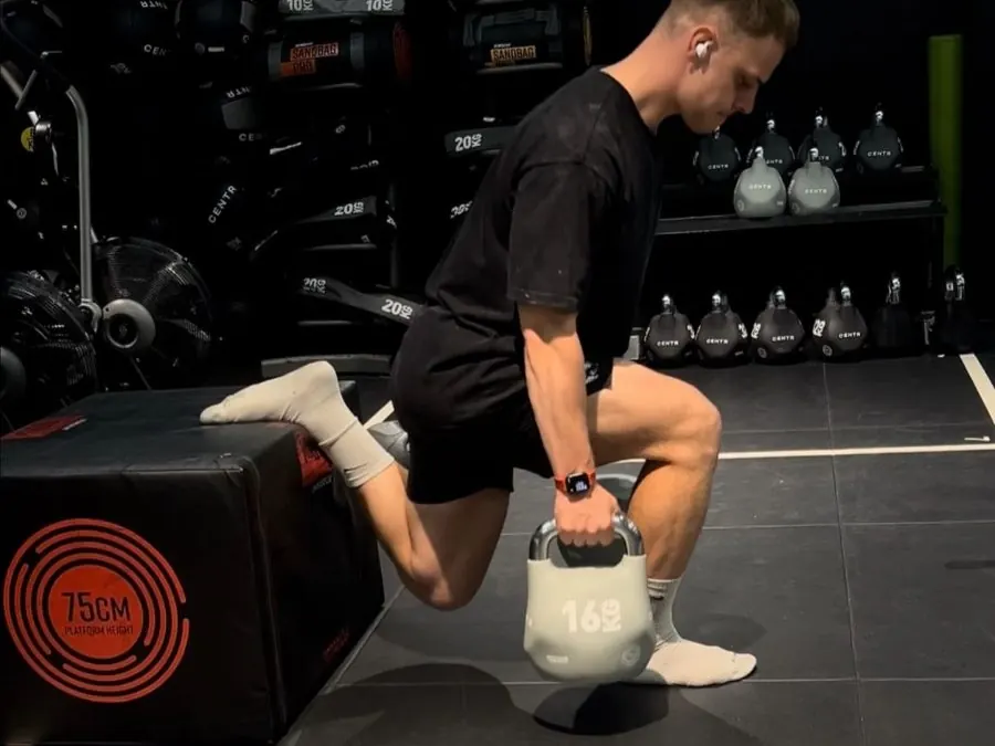 Cameron Cooper training with a kettlebell
