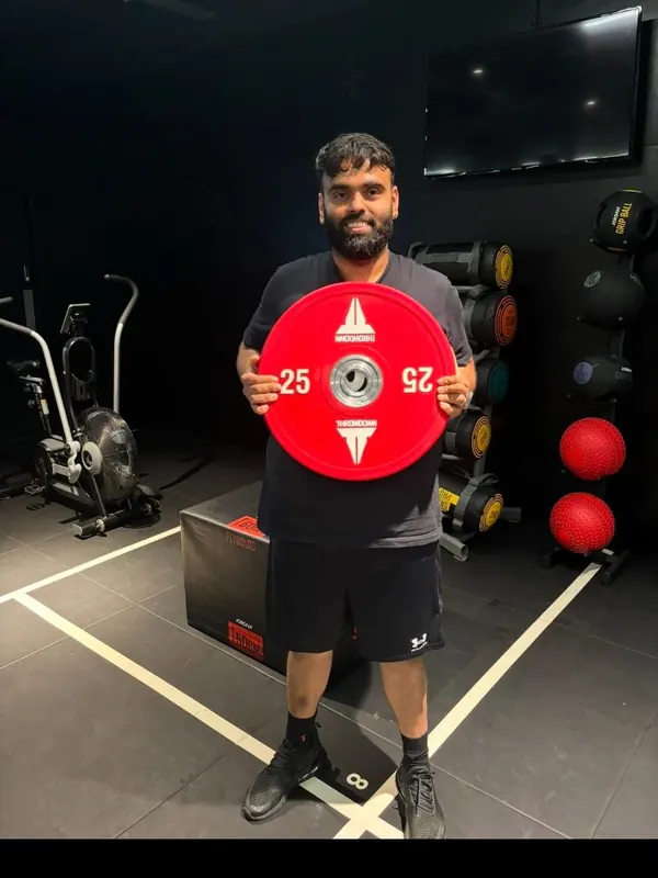 Rasi holding the weight he lost